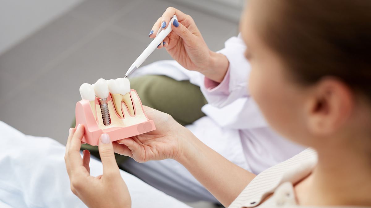 Dentist explaining how dental implants are performed, Las Vegas, NV